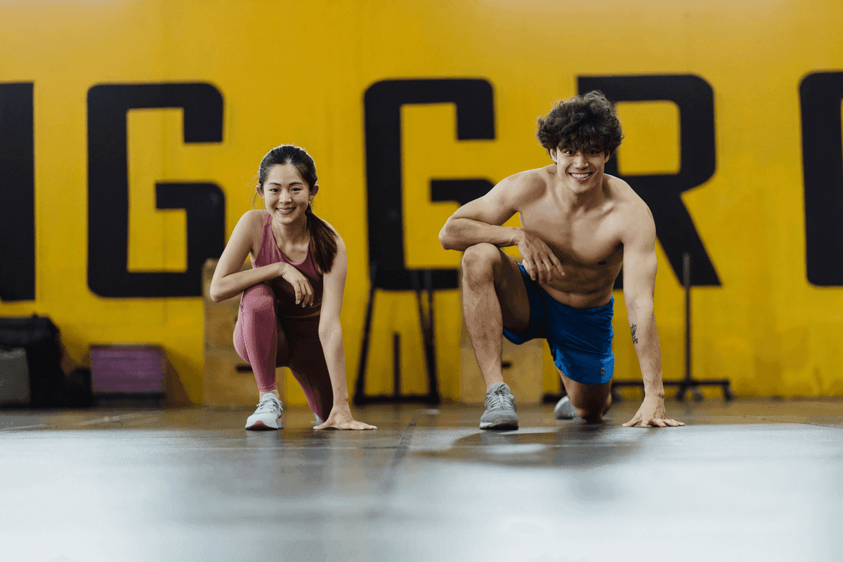 Young sportman and sportive woman are smiling and look happy when have healthy testosterone levels